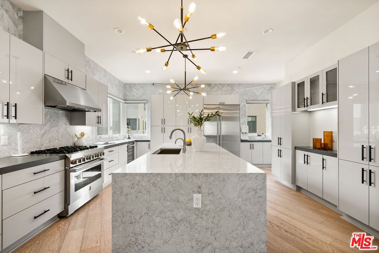 Interior, Kitchen, Marble Walls, Pendant Lights, Recessed Lighting, Stainless Steel Appliances, Wood Texture Flooring