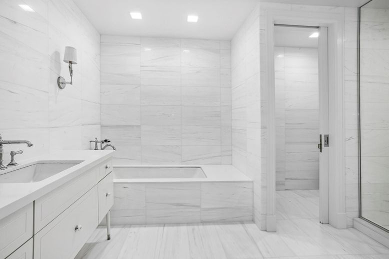Bathroom, Dual Sink Vanities, Glass Shower, Interior, Marble, Marble Walls, Recessed Lighting