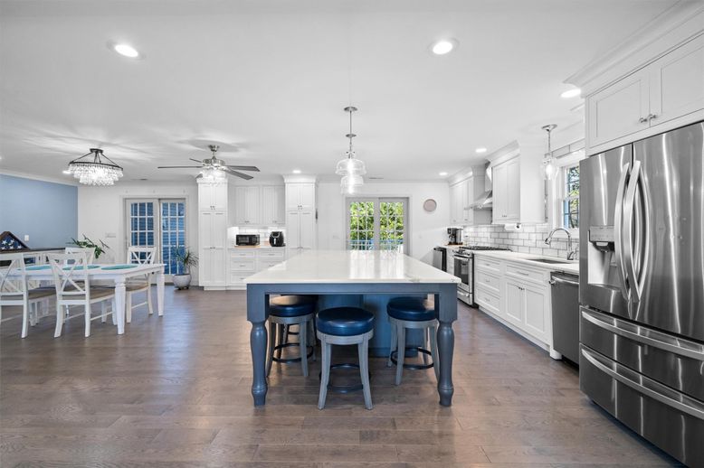 Chandelier, Dining room, Interior, Kitchen, Pendant Lights, Recessed Lighting, Stainless Steel Appliances, Wood Texture Flooring