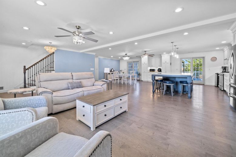 Chandelier, Dining room, Interior, Kitchen, Living room, Pendant Lights, Recessed Lighting, Stainless Steel Appliances, Wood Texture Flooring