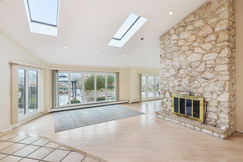 Empty room, Fireplace, Interior, Recessed Lighting, Stone Walls, Wood Texture Flooring