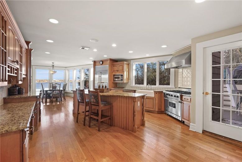 Chandelier, Dining room, Interior, Kitchen, Pendant Lights, Recessed Lighting, Stainless Steel Appliances, Wood Texture Flooring