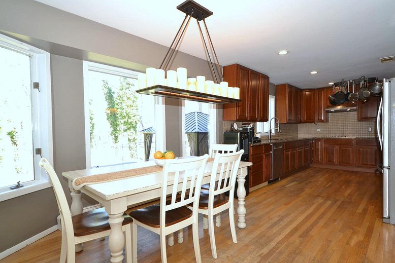 Chandelier, Dining room, Interior, Kitchen, Recessed Lighting, Stainless Steel Appliances, Wood Texture Flooring