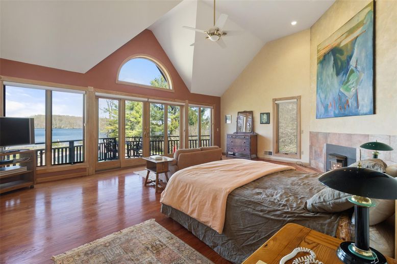 Bedroom, Fireplace, Interior, Recessed Lighting, Water, Wood Texture Flooring