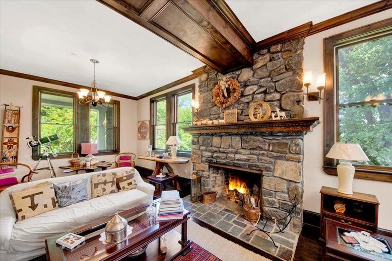 Chandelier, Dining room, Fireplace, Interior, Living room, Stone Walls, Wood Texture Flooring