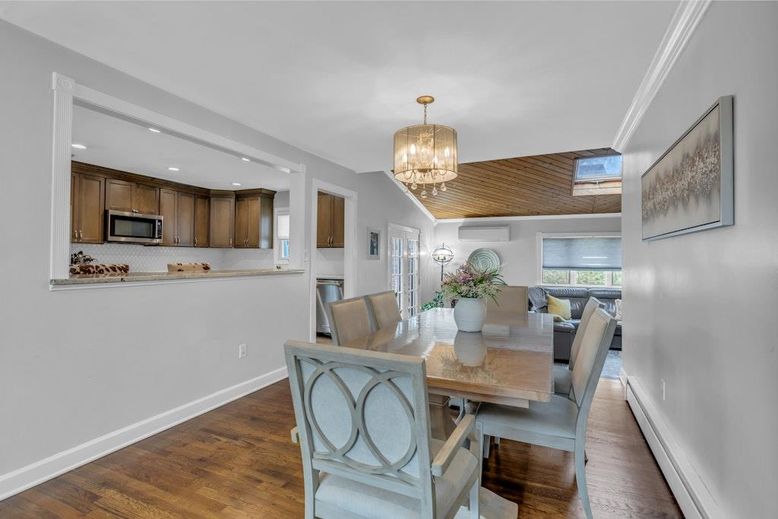 Chandelier, Dining room, Interior, Kitchen, Recessed Lighting, Stainless Steel Appliances, Wood Texture Flooring