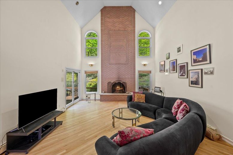 Fireplace, Interior, Living room, Recessed Lighting, Stone Walls, Wood Texture Flooring