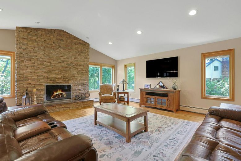 Fireplace, Interior, Living room, Recessed Lighting, Stone Walls, Wood Texture Flooring