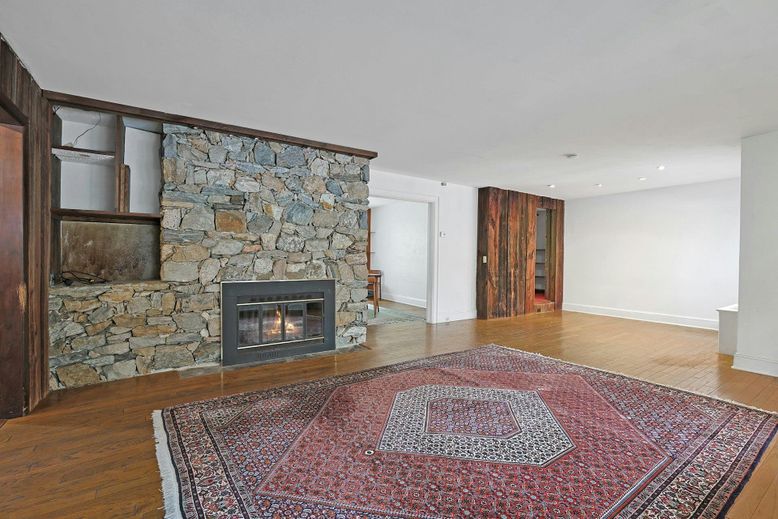 Empty room, Fireplace, Interior, Recessed Lighting, Stone Walls, Wood Texture Flooring