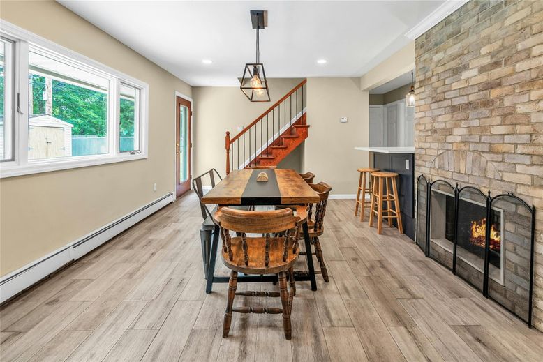 Dining room, Fireplace, Interior, Pendant Lights, Recessed Lighting, Stone Walls, Wood Texture Flooring