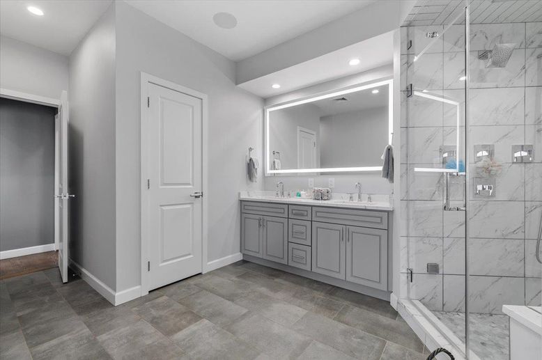 Bathroom, Dual Sink Vanities, Glass Shower, Interior, Marble Walls, Recessed Lighting