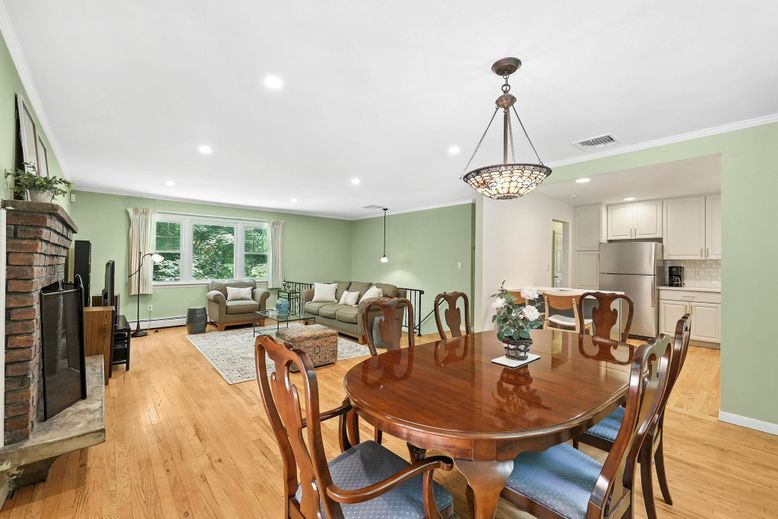 Dining room, Fireplace, Interior, Kitchen, Living room, Pendant Lights, Recessed Lighting, Stainless Steel Appliances, Wood Texture Flooring