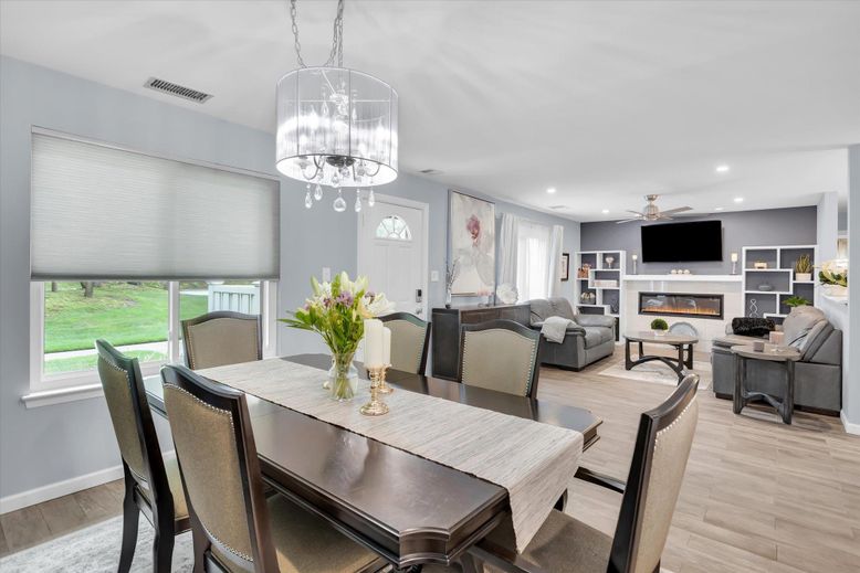 Chandelier, Dining room, Fireplace, Interior, Living room, Pendant Lights, Recessed Lighting, Wood Texture Flooring