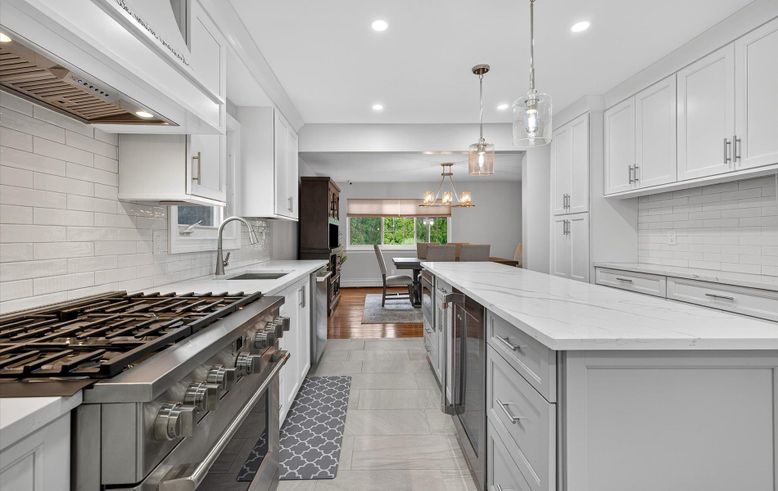 Chandelier, Dining room, Interior, Kitchen, Pendant Lights, Recessed Lighting, Stainless Steel Appliances, Wood Texture Flooring