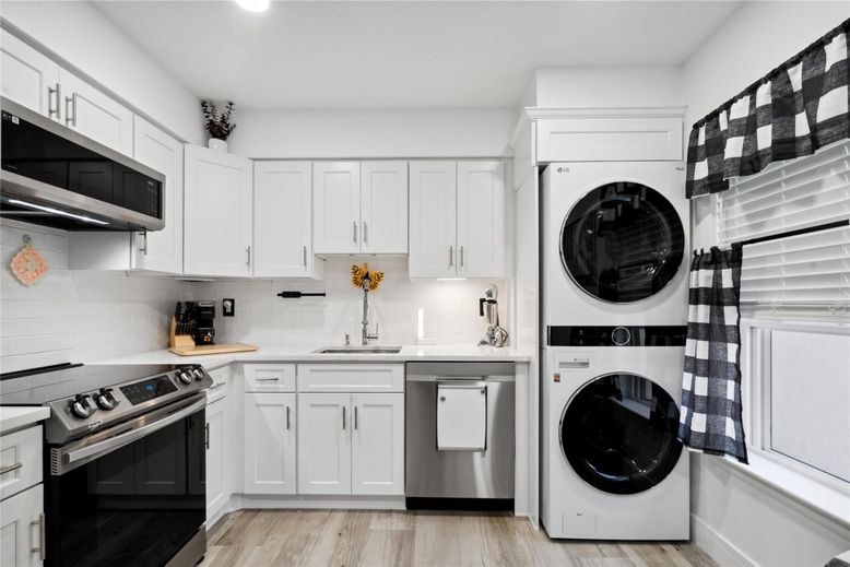 Interior, Kitchen, Recessed Lighting, Stainless Steel Appliances, Washer, Wood Texture Flooring