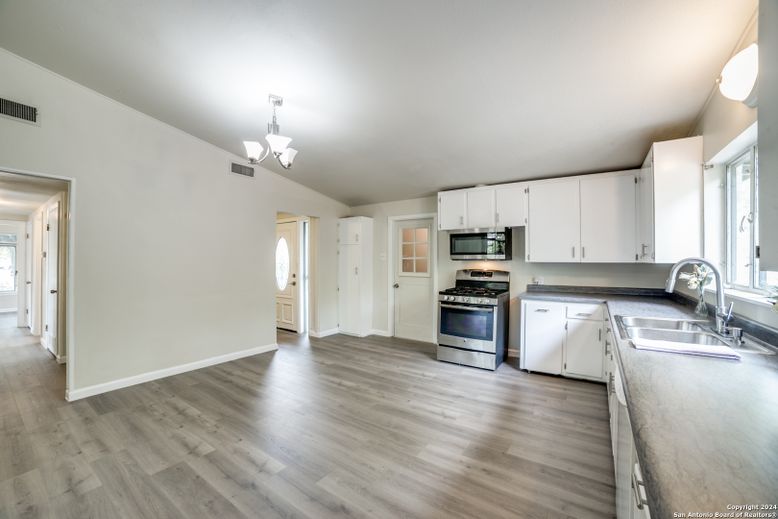 Chandelier, Interior, Kitchen, Pendant Lights, Stainless Steel Appliances, Wood Texture Flooring