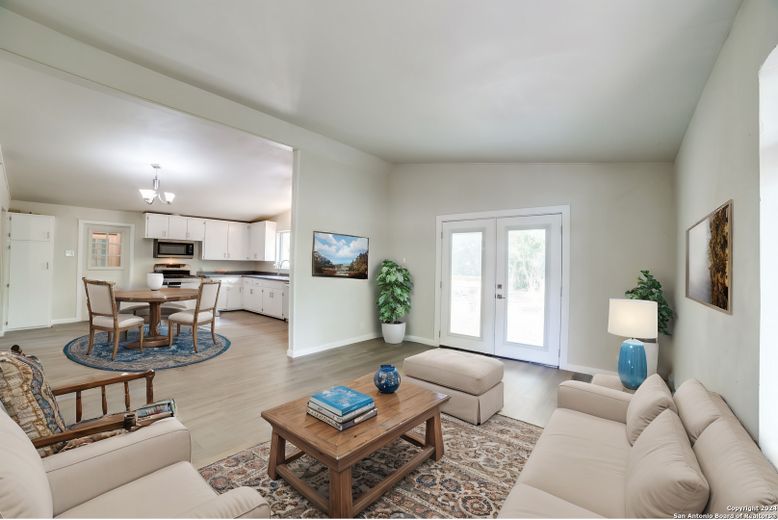 Chandelier, Dining room, Interior, Kitchen, Living room, Stainless Steel Appliances, Wood Texture Flooring