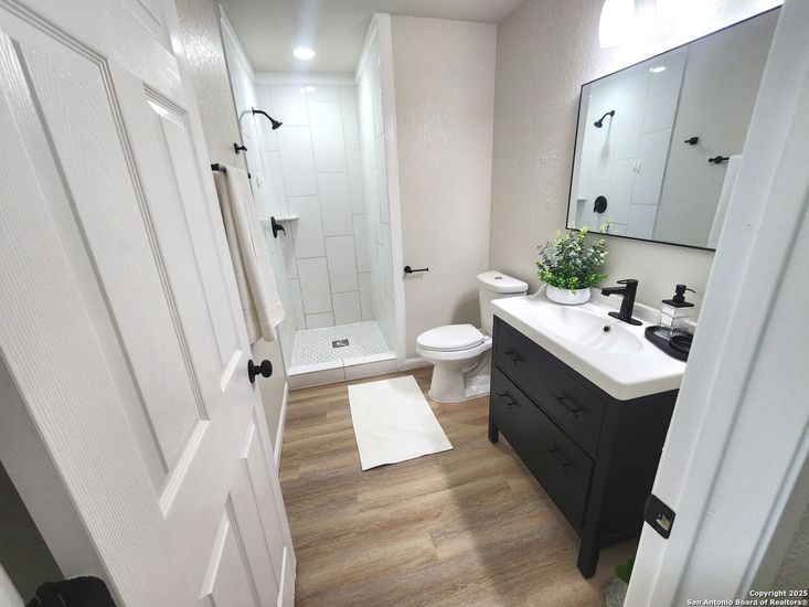 Bathroom, Dual Sink Vanities, Interior, Recessed Lighting, Wood Texture Flooring