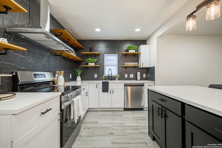 Interior, Kitchen, Marble Walls, Recessed Lighting, Stainless Steel Appliances, Wood Texture Flooring