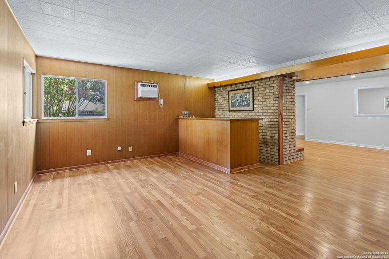 Empty room, Fireplace, Interior, Recessed Lighting, Stone Walls, Wood Texture Flooring, Wooden Walls
