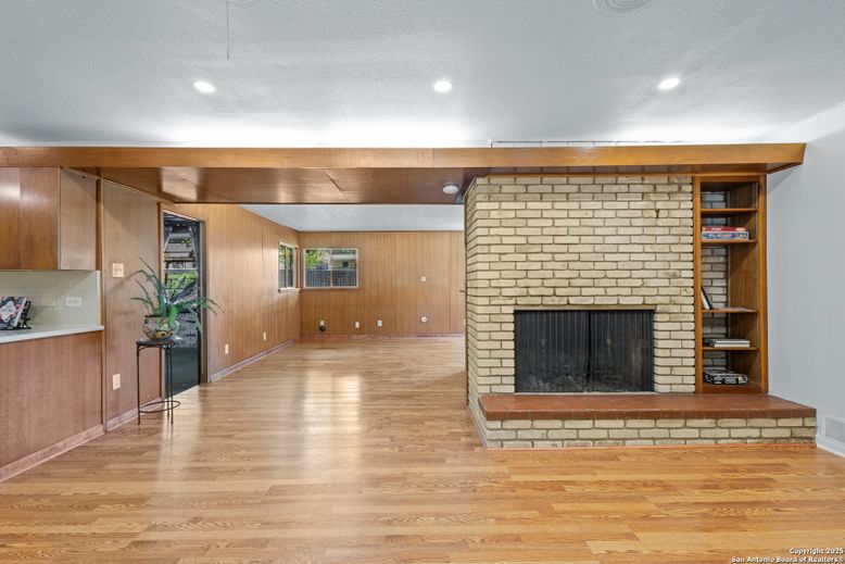 Empty room, Fireplace, Interior, Recessed Lighting, Stone Walls, Wood Texture Flooring, Wooden Walls