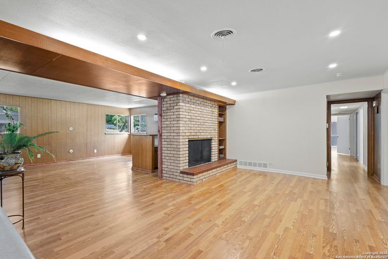 Empty room, Fireplace, Interior, Recessed Lighting, Stone Walls, Wood Texture Flooring, Wooden Walls