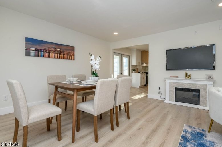 Dining room, Fireplace, Interior, Kitchen, Recessed Lighting, Wood Texture Flooring
