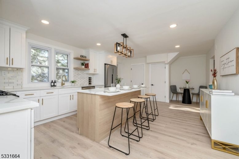 Chandelier, Dining room, Interior, Kitchen, Pendant Lights, Recessed Lighting, Stainless Steel Appliances, Wood Texture Flooring