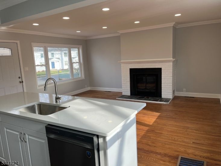 Fireplace, Interior, Kitchen, Recessed Lighting, Wood Texture Flooring