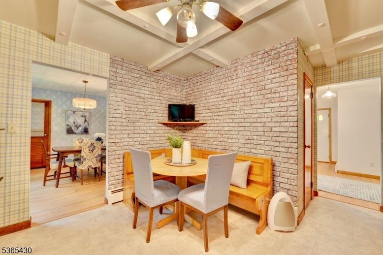 Chandelier, Dining room, Interior, Pendant Lights, Recessed Lighting, Stone Walls, Wood Texture Flooring