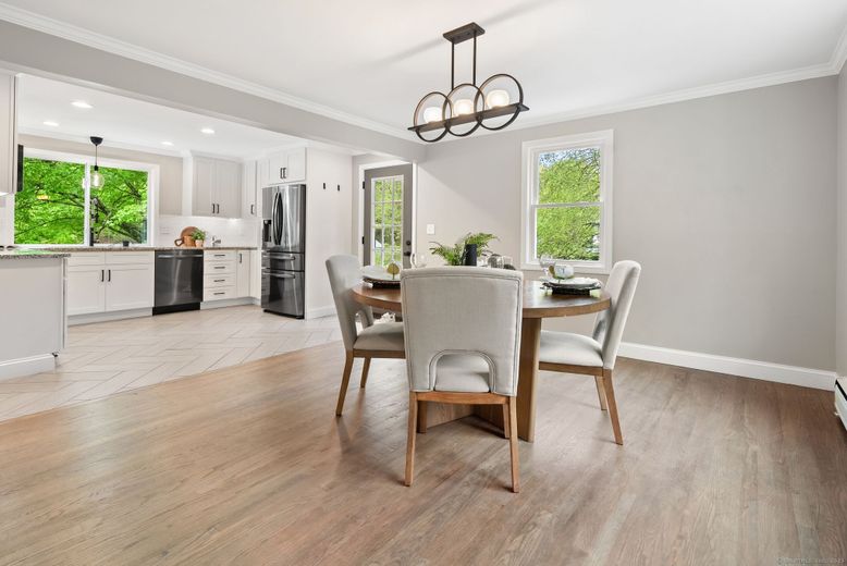 Chandelier, Dining room, Interior, Kitchen, Recessed Lighting, Stainless Steel Appliances, Wood Texture Flooring