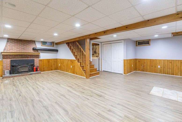 Empty room, Fireplace, Interior, Recessed Lighting, Stone Walls, Wooden Beams, Wood Texture Flooring, Wooden Walls